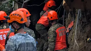 Rescue teams working at the Cebu waste dump
